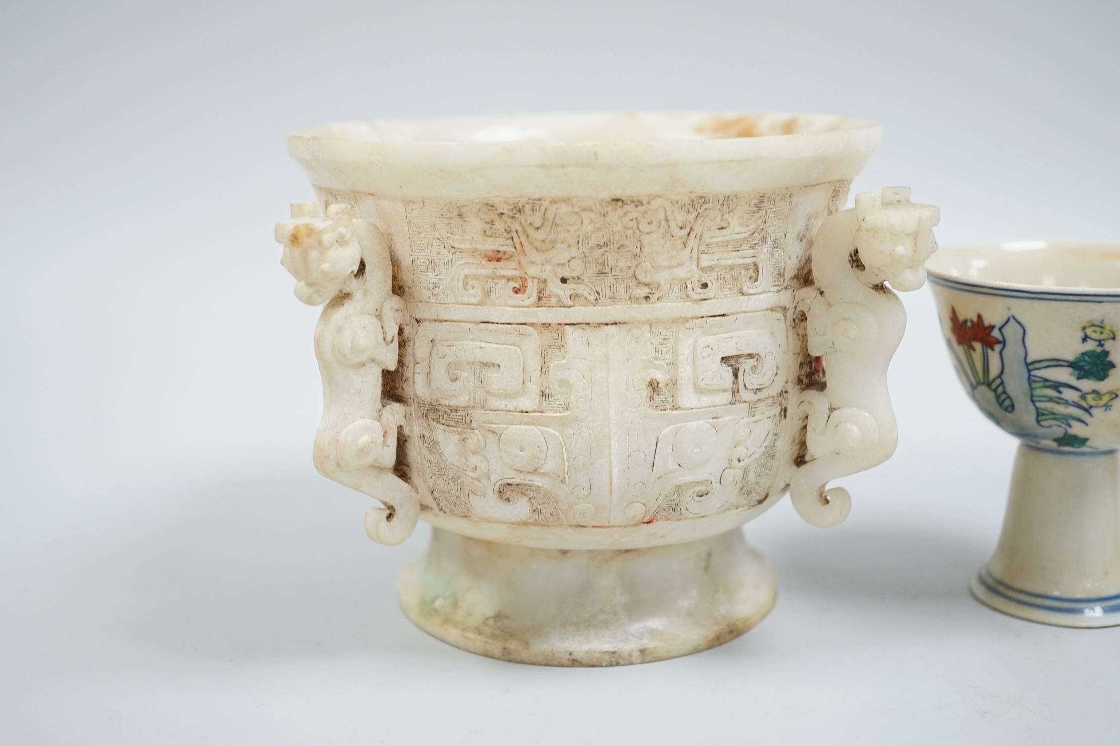 A Chinese burnt jade or hardstone censer, a stone cup and a doucai stem cup, censor 12cm high